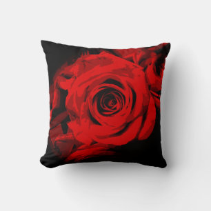 Rote Rose auf dem schwarzen Kissen