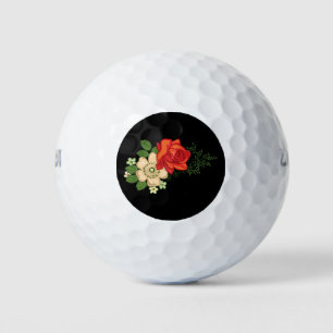 Rote Rose und Gänseblümchen vor schwarzem Hintergr Golfball