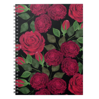 Rote Rosen auf schwarz. Notizblock