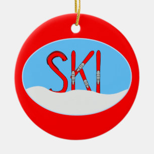 Rote Skier und Schnee in einem Oval Keramik Ornament