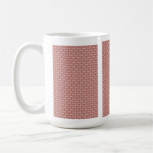 Rote und rosa Textilien auf einem gemusterten Tepp Kaffeetasse