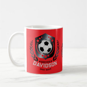 Rote und schwarze Fußball für sportliche Männer un Kaffeetasse