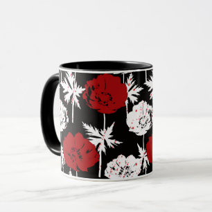 Rote, weiße Blume auf schwarz Tasse