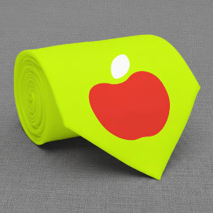 roter Apfel in neon-gelber Krawatte