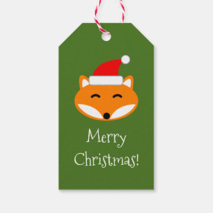 Roter Fuchs frohe Weihnachten nach und von leerem Geschenkanhänger