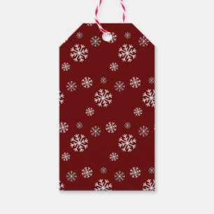 Roter Geschenkanhänger mit Schneefall