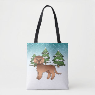 Roter Mini Goldendoodle Hund in einem Winterwald Tasche