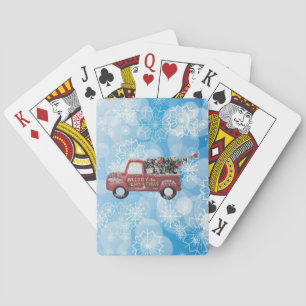 roter Oldtimer-LKW auf blauem Schneeflocken-Hinter Spielkarten