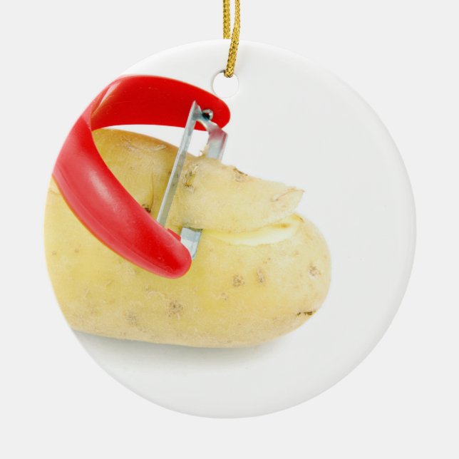 Roter Peeler, der Kartoffel auf weißem Hintergrund Keramikornament (Vorne)