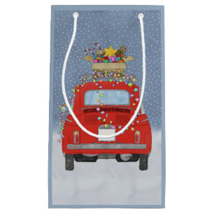 Rotes Auto mit Weihnachtsgeschenken Kleine Geschen Kleine Geschenktüte