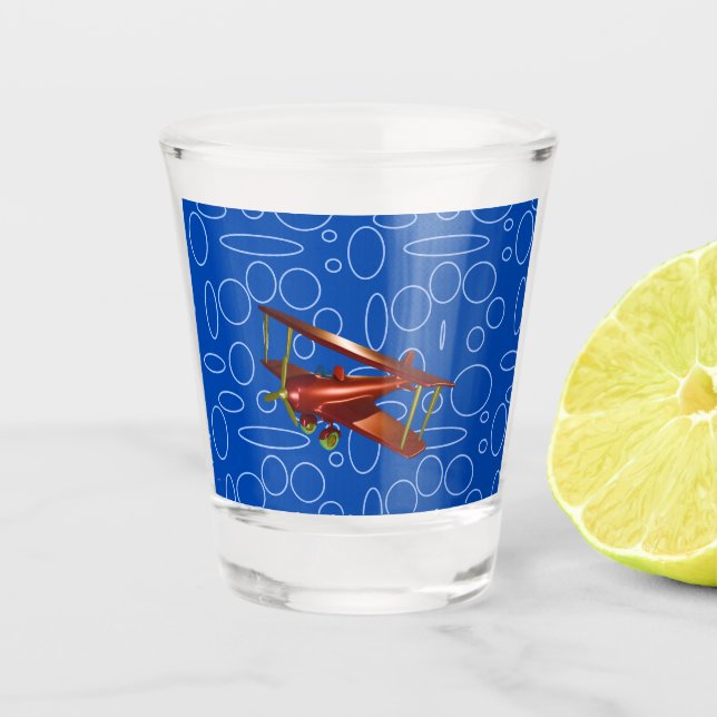 Rotes Bi-Flugzeug auf blauem Kreislauf und Loops-G Schnapsglas (Vorderseite)