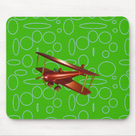 Rotes Doppeldeckerflugzeug auf grünen Kreisen und Mousepad