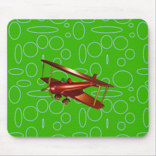 Rotes Doppeldeckerflugzeug auf grünen Kreisen und Mousepad