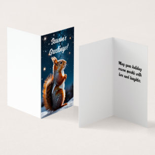 Rotes Eichhörnchen in der Weihnachtskarte des Schn