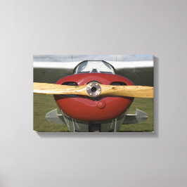 Rotes Flugzeug und Holzschrauber Leinwanddruck