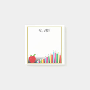 Rotes gefärbtes Apple zeichnet eine Anmerkung vom Post-it Klebezettel