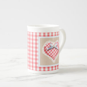 Rotes Gingham-Herz mit Bogengraphik Prozellantasse