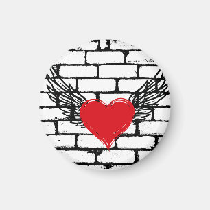 Rotes Herz mit Engelsflügeln an einer Ziegelwand Magnet