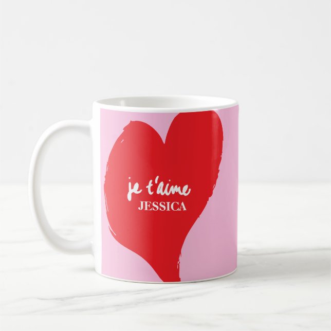 Rotes Herz mit je t’aime-Text auf rosa Hintergrund Kaffeetasse (Links)