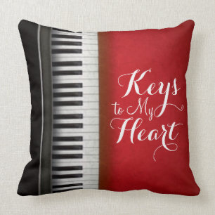 Rotes Schwarz-weißes Klavier befestigt Typografie Kissen