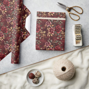 Rotes und goldenes florales Design mit Boho-Wasser Geschenkpapier