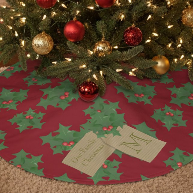 Rotes und grünes Holly Monogram Weihnachtsbaumrock Polyester Weihnachtsbaumdecke (Festive tree skirt with a green holly pattern with red berries & space for your family name/initial)