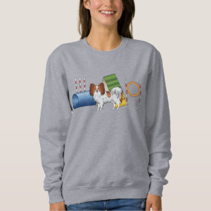 Rotes und weißes Papillon mit Agility Sweatshirt
