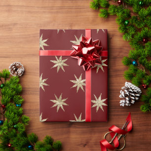 Rotes Weihnachtspapier mit goldenem Sternenmuster Geschenkpapier
