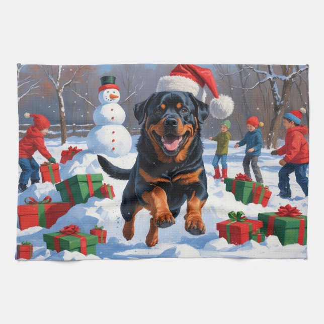Rottweiler läuft im Schnee mit Weihnachtshut Geschirrtuch (Horizontal)