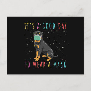 Rottweiler trage eine Maske, die einen guten Tag z Postkarte