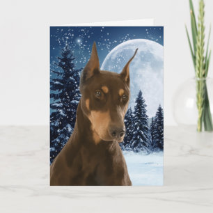 Rouge et carte de Noël de dobermann de rouille