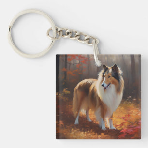 Rough Collie dans les feuilles d'automne qui tombe