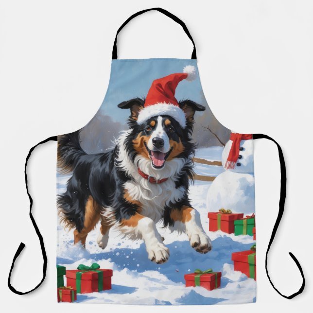 Rough Collie läuft im Schnee mit Weihnachtshut Schürze (Vorderseite)