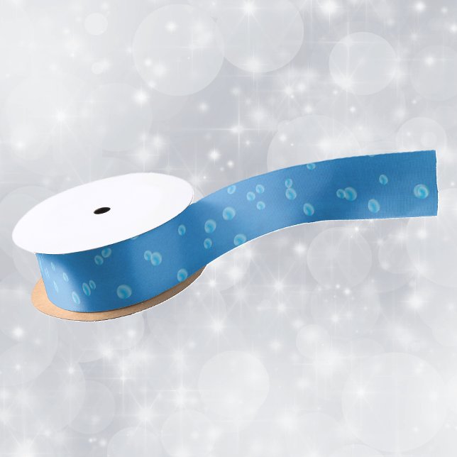 Ruban En Satin Bleu Joli et vibrant avec bulles d'eau (Blue white water bubbles on roll of vibrant deep blue ribbon for crafting or gift wrap.)