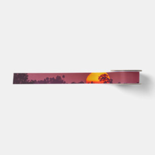 Ruban En Satin Soleil orange sur ciel rose violet