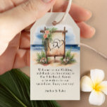 Rustic Beach Hochzeit in Urlaubsort Welcome Bag Geschenkanhänger<br><div class="desc">Zielort Hochzeitsfeiern für Sie, um Ihre Begrüßungsgeschenke personalisieren. Dieses charmante Design besticht durch eine Aquarelllandschaft mit einer romantischen rustikalen Willkommensplattform am Strand, die mit tropischen Blume geschmückt ist. Ideal für eine lässige oder schicke Strandhochzeit, eine schicke Hochzeit in Urlaubsort an der Küste oder eine schicke Strandanlage. Hintergrund und Text haben...</div>