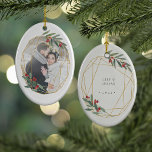 Rustic Bloom First Christmas Photo Keramikornament<br><div class="desc">Sweet photo ornament features your little one's photo framed by an oval wreath of watercolor botanical foliage and rustic flowers. Personalize the back with your custom caption (shown with "[name's] first Christmas" and the year.</div>