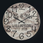 Rustic Personalized Grey Wood Custom Large Clock Große Wanduhr<br><div class="desc">Beautiful, unique, one-of-a-kind personalized design features a faux-rustic grey wood with black personalization his and her names in a script font overlay design and the last name and year established in a bold script with a printed wood effect background. Personalize this clock by adding your personal information. Makes a great...</div>