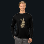 Rustic Rabbit Tri-Blend Shirt<br><div class="desc">Embrace the charm of the countryside with this beautifully detailed sketch of a bunny enjoying a carrot. With a vintage,  hand-drawn aesthetic and soft sepia tones,  this design brings a touch of rustic warmth to your wardrobe. Perfect for gardeners,  nature lovers,  or anyone who appreciates classic animal illustrations.</div>