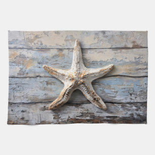 Rustikaler Starfish auf gewittertem Holz Geschirrtuch
