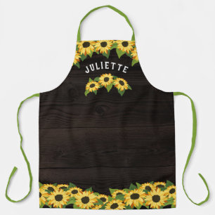 Rustische Sonnenblumen und dunkler Holzername Schürze