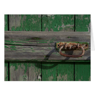 Rusty Door Handle an der grünen Tür