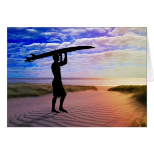 Sable et nuages de surfer de coucher du soleil