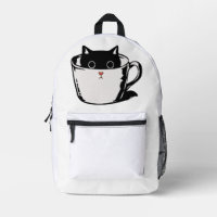 Chaton noir avec nez rouge caché dans une tasse