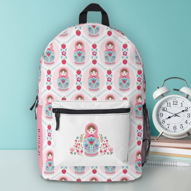 Sac À Dos Imprimé Jolie école de filles roses (A cute pink nesting doll decorates this backpack.Personalize it with your name on the side.)
