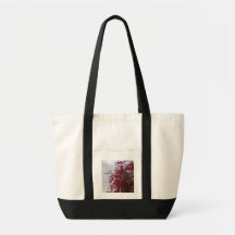 Sac à main vibrant rouge de photographie de fleurs