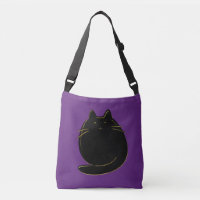 Chat mignon de noir et d'or sur le pourpre