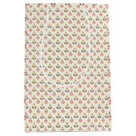 Sac Cadeau Moyen Deux sacs-cadeaux avec des motifs répétitifs sur l