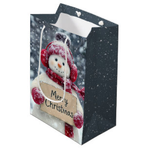 Sac Cadeau Moyen Snowman tenant un joyeux signe de Noël