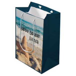 Sac Cadeau Moyen Starfish sur une plage de sable Photo